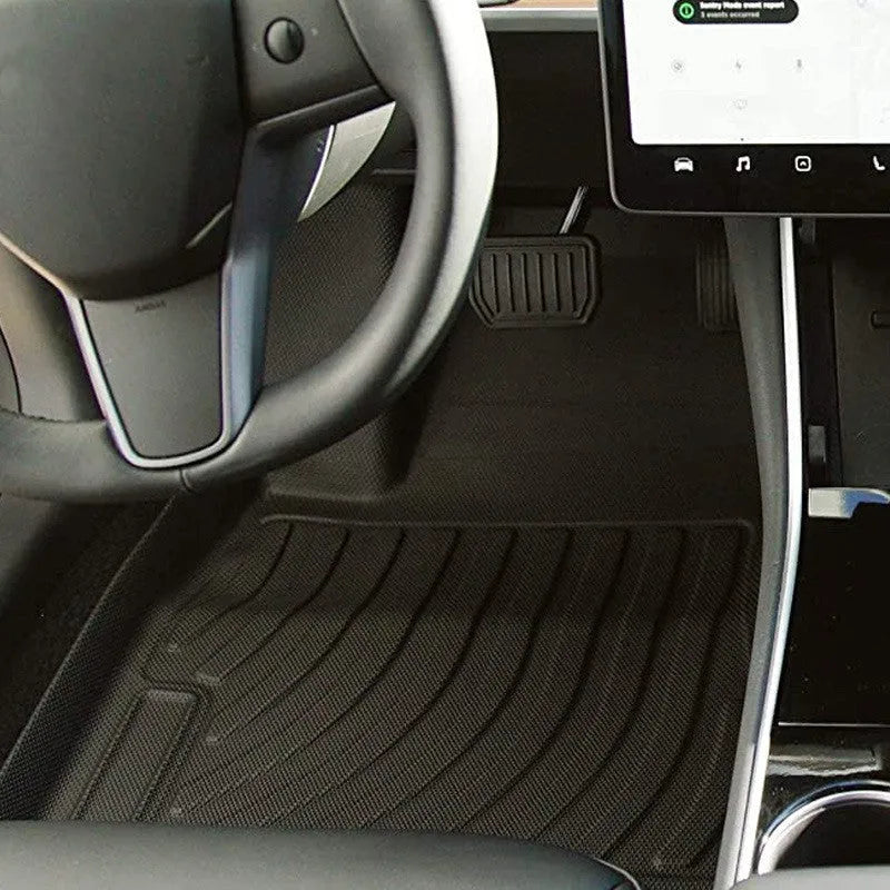 Rubber floor mats with TPE footrests designed for Tesla Model 3, Y, S, and X vehicles.