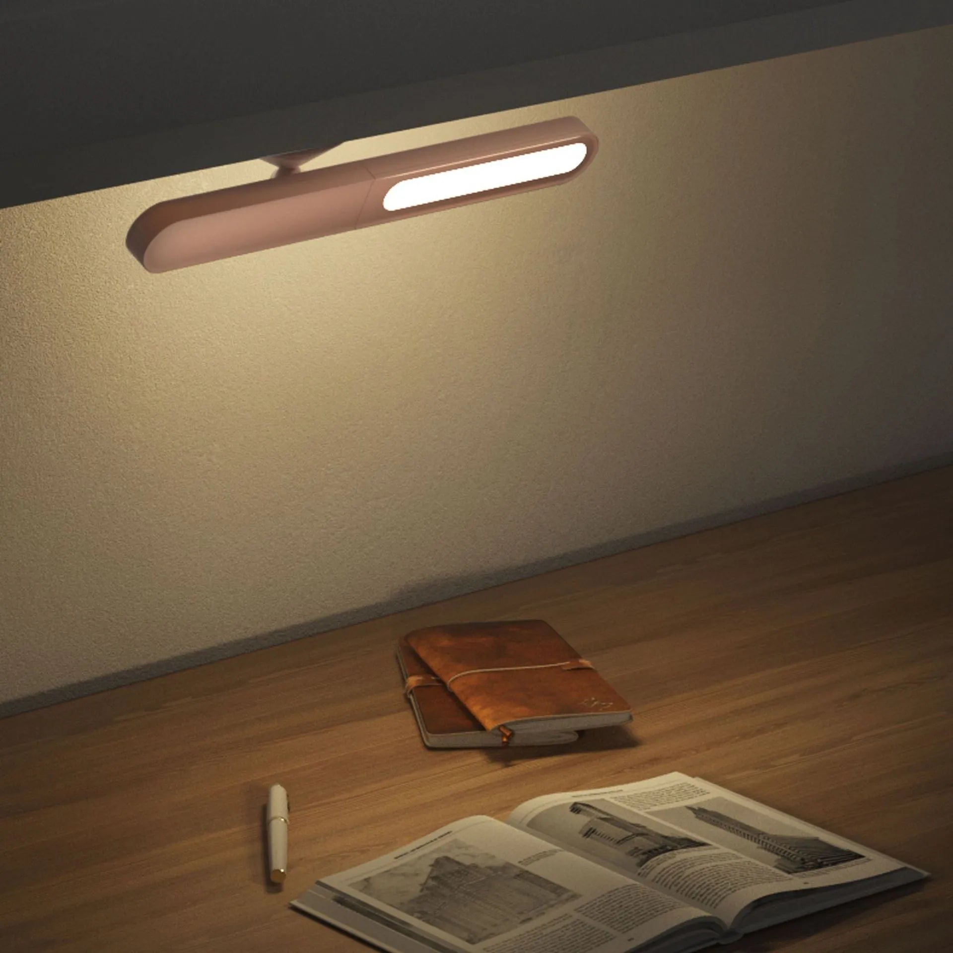 Geometric design table lamp with magnetic base on desk next to USB cable
