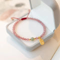 Hand-woven red rope bracelet with strawberry quartz crystals in national tide style