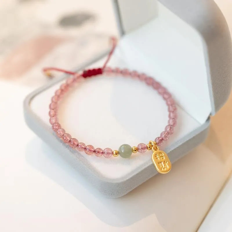 Hand-woven red rope bracelet with strawberry quartz crystals in national tide style