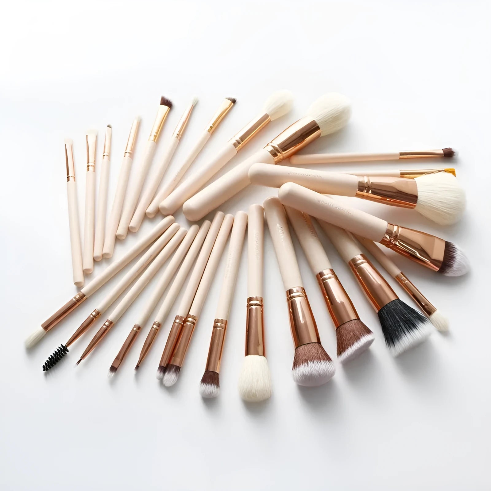 26 pink makeup brushes with wooden handles laid out next to a matching storage bag.