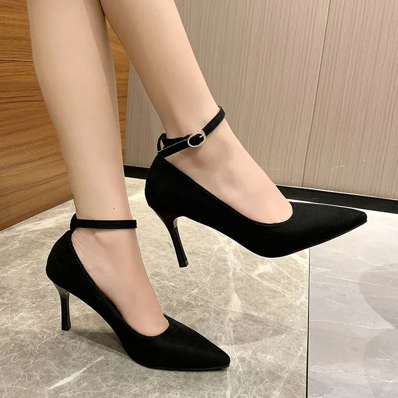 Women's black stiletto heel pump shoes with buckle detail and skull pattern