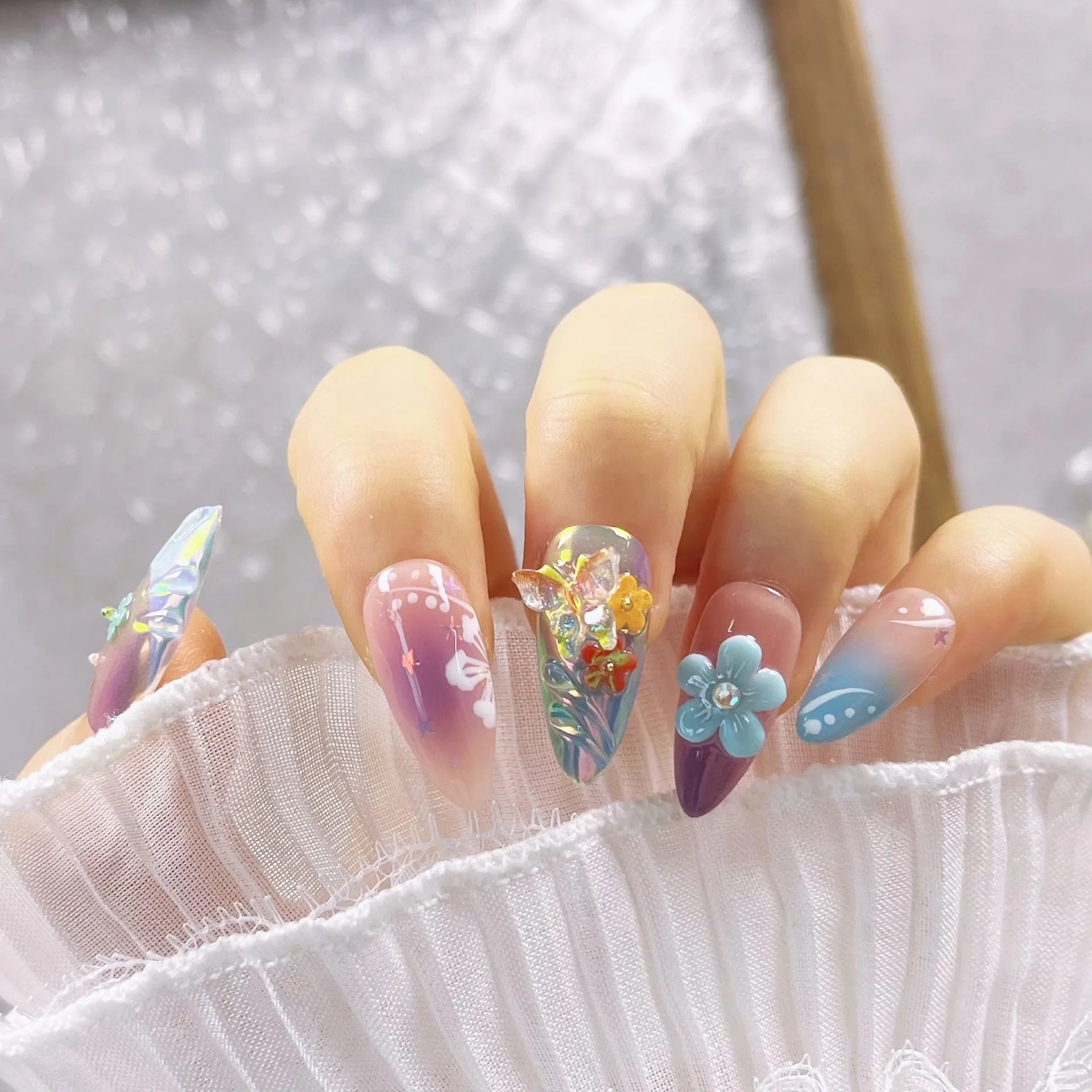 Handmade colourful nail art sculptures with embossed flower and butterfly patterns in four sizes