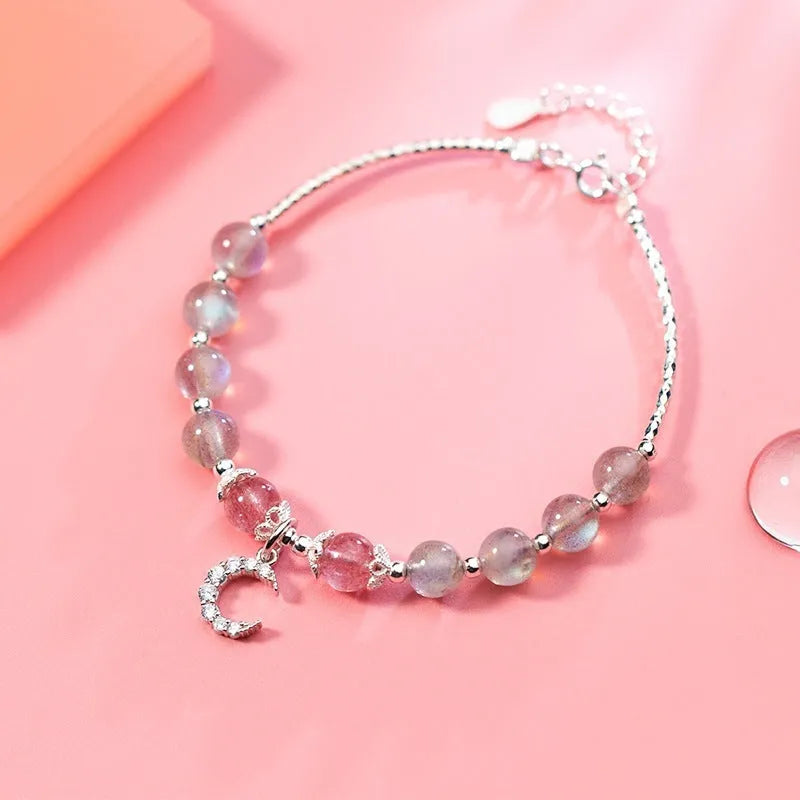 Handmade adjustable moonstone bracelet with crescent moon charm showing 6mm beads and extension chain