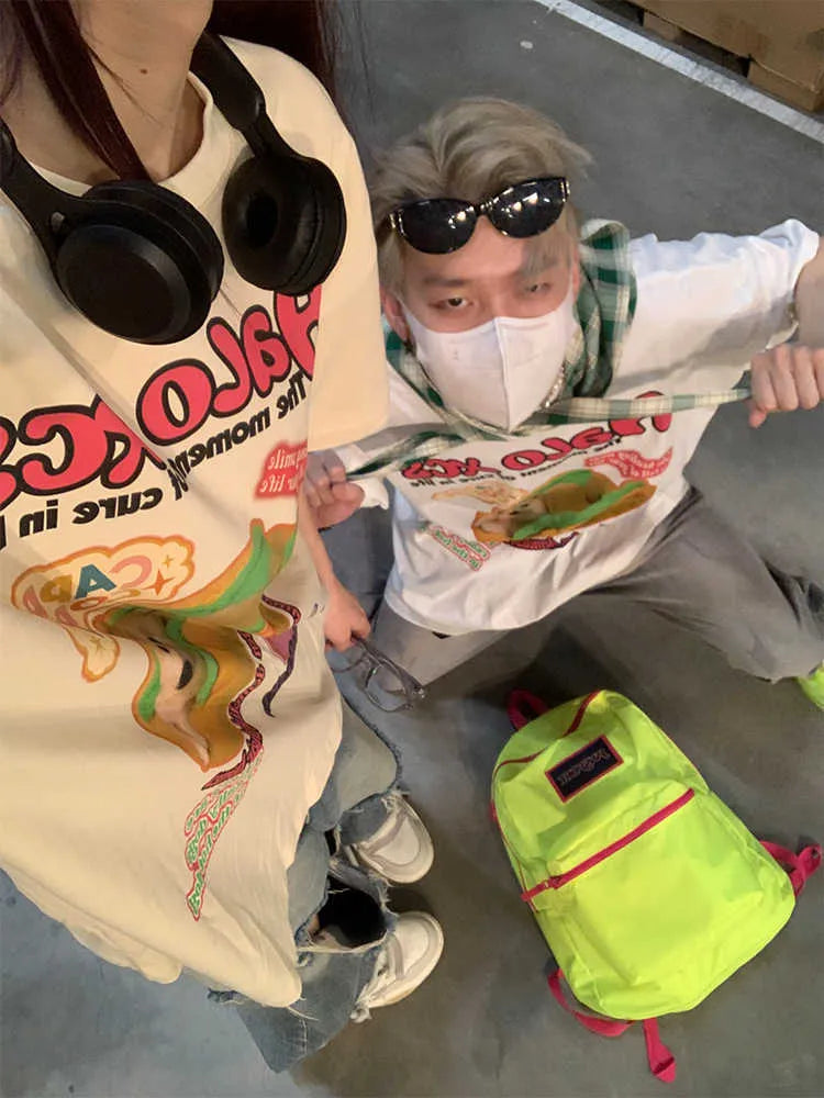 Cartoon hamburger dog printed cotton T-shirt in loose fit, shown in apricot colour.