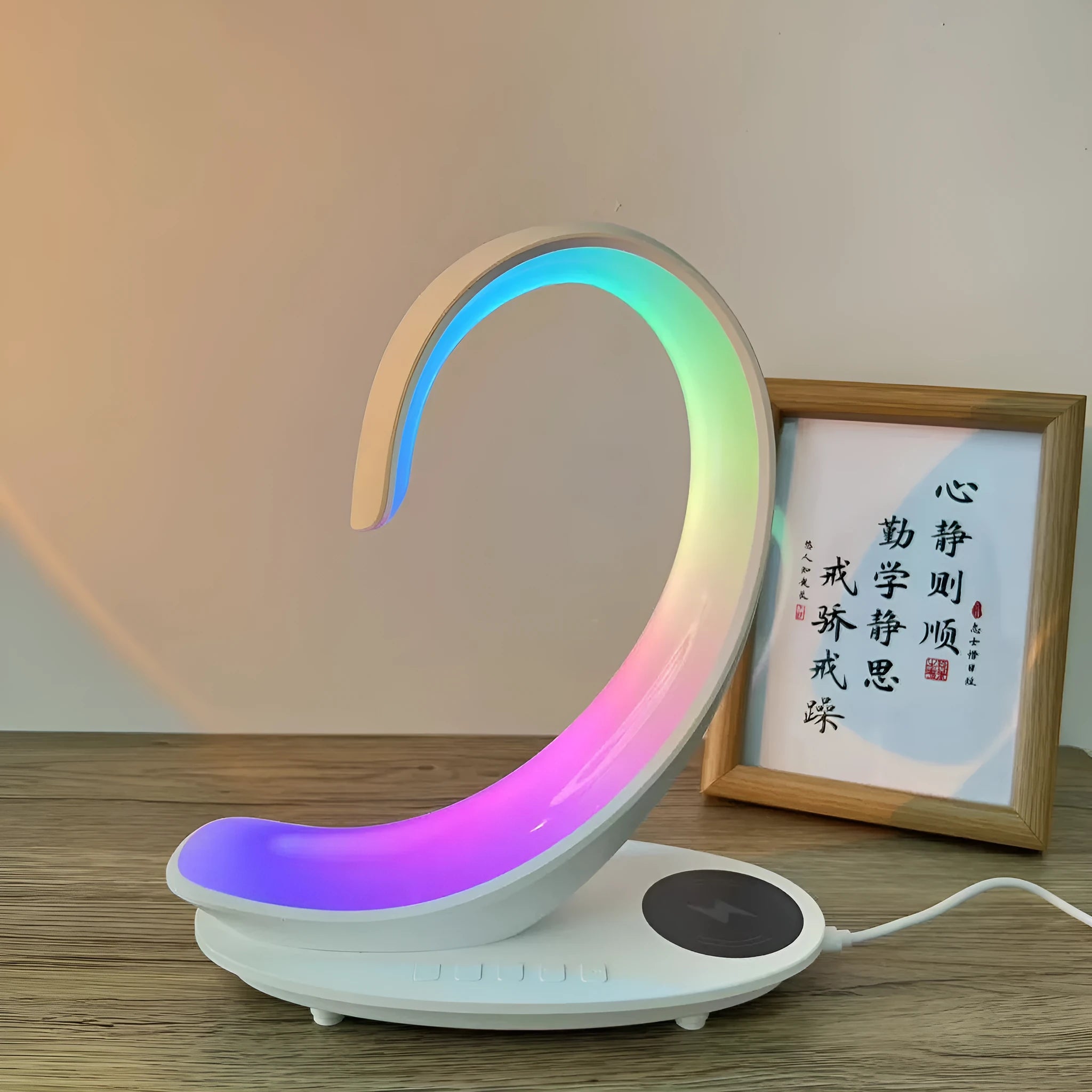 White swan decorative lamp with wireless charging pad and Bluetooth speaker featuring colourful LED lights