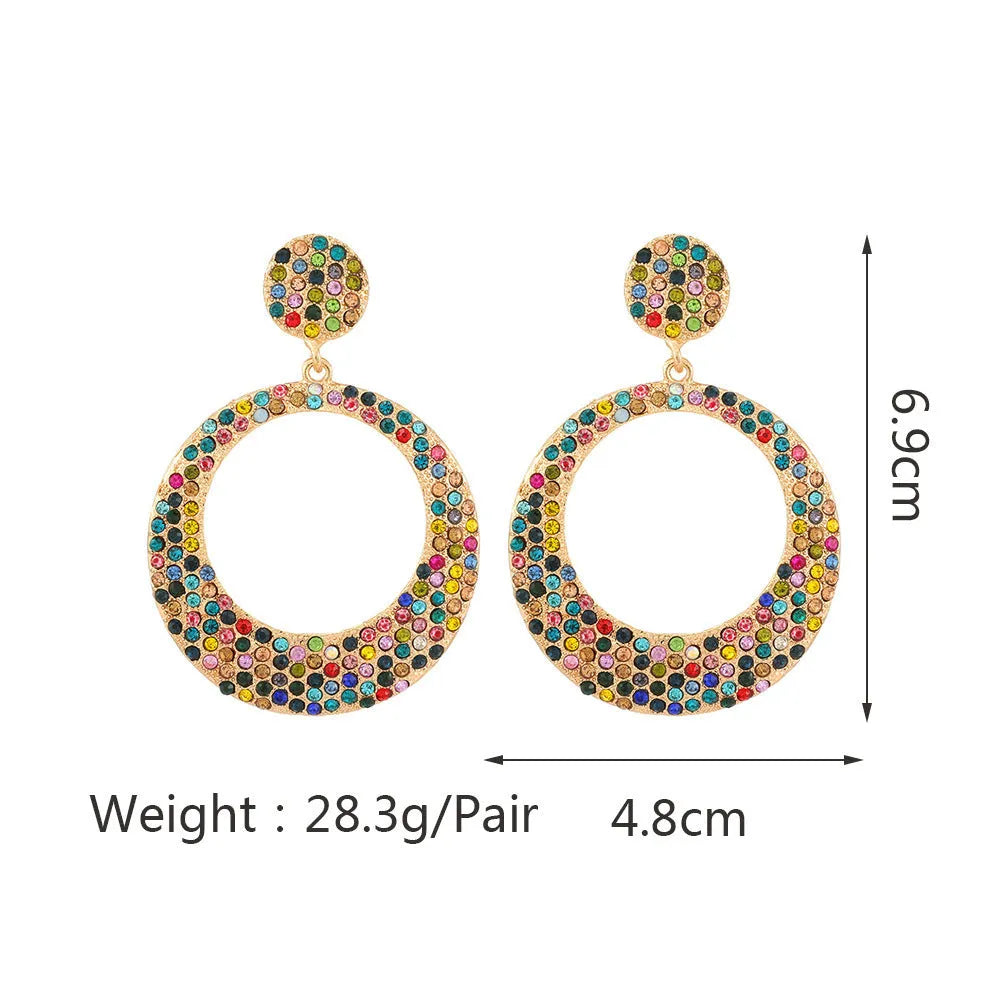 A pair of large round colourful metal pendant earrings in a cartoon style for women.
