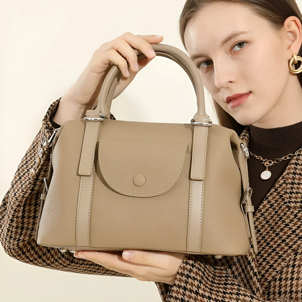 Women's genuine leather handbag in street-trend style with lock closure and contrast stitching