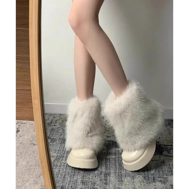 Women's black fleece-lined snow boots with a round toe, low top, and waterproof platform sole.