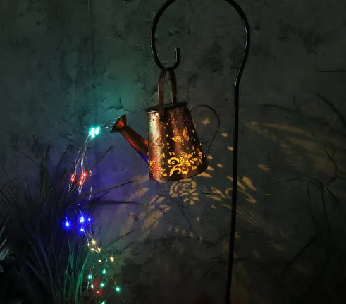 Solar-powered iron butterfly garden lamp with warm white LED lighting for outdoor decorative use