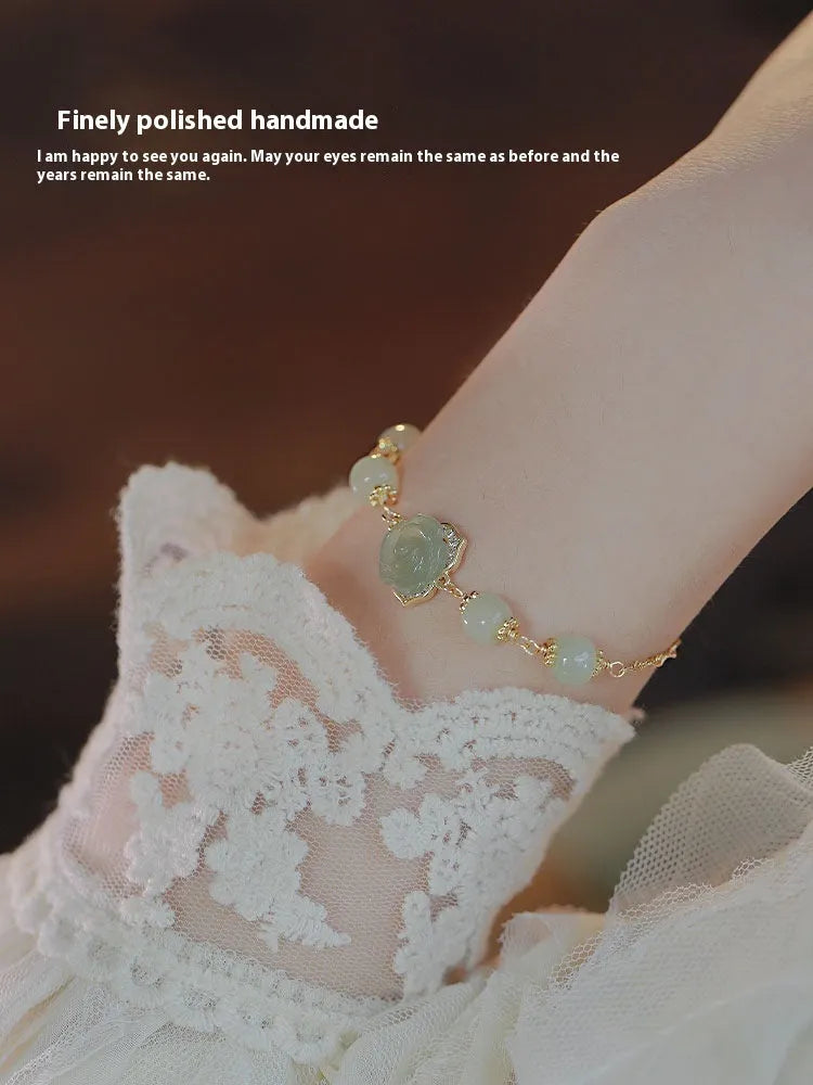 Women's bracelet with Hetian jade rose design and 14K gilded floral elements