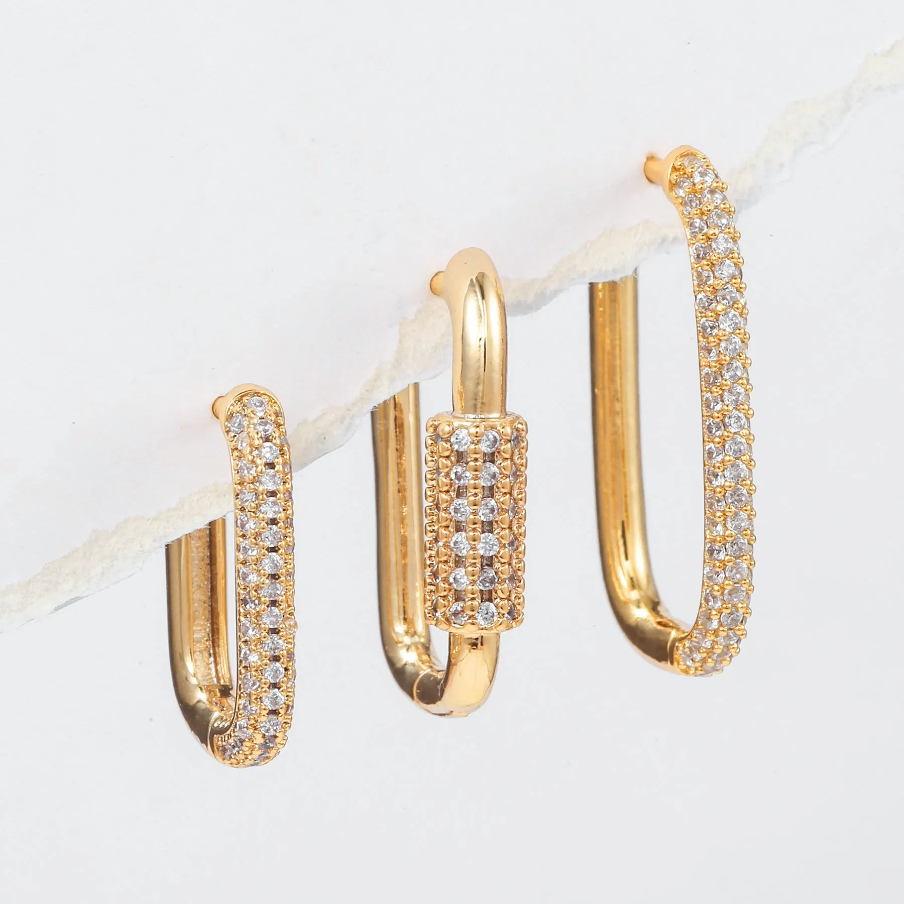 Three geometric square ear clips with inlaid zircon stones in gold and white colour options