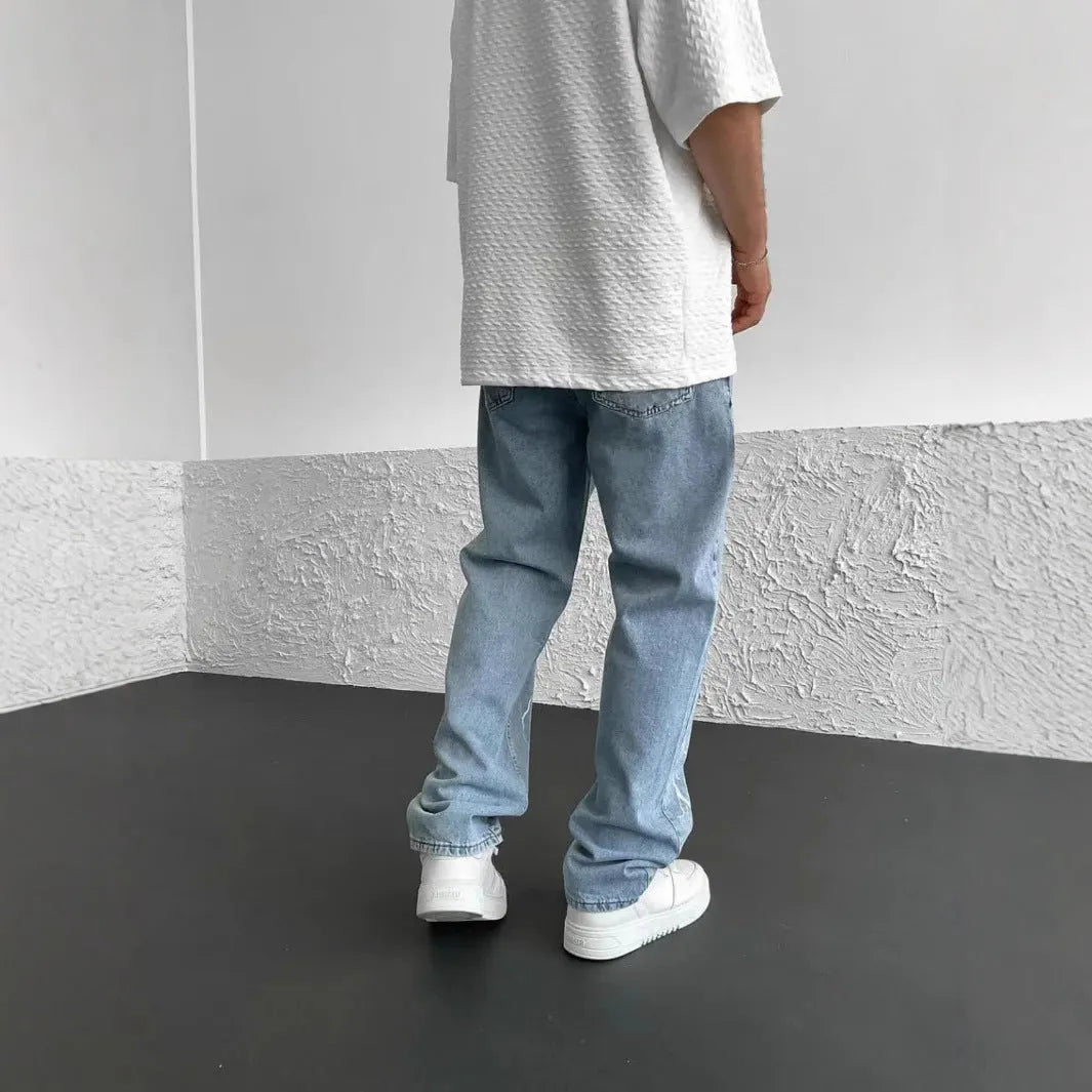 Men's straight-leg denim trousers in loose wide-leg fit with solid colour print and zipper fly