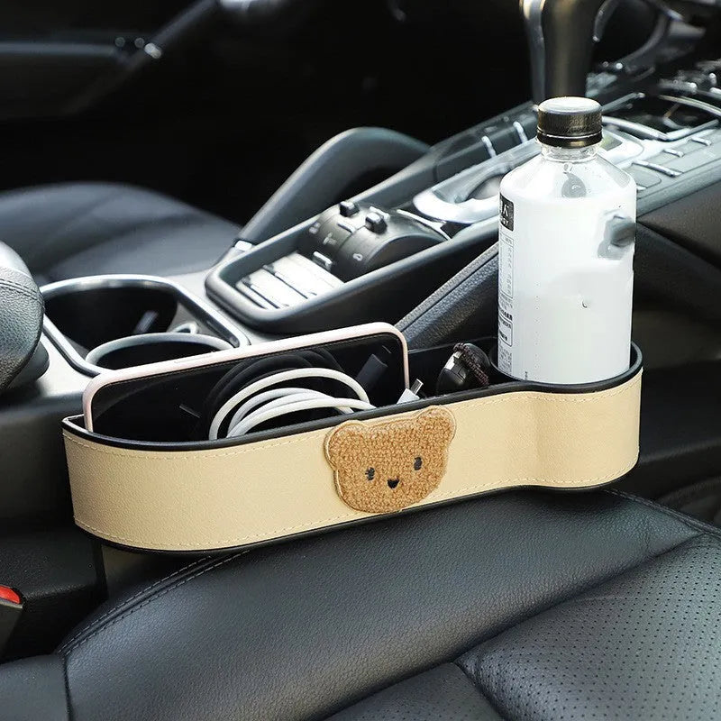 Leather car seat gap storage box with cartoon bear design in black or beige filling the console gap