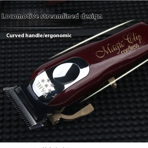 Charging hair clipper with stainless steel cutter head on a white background