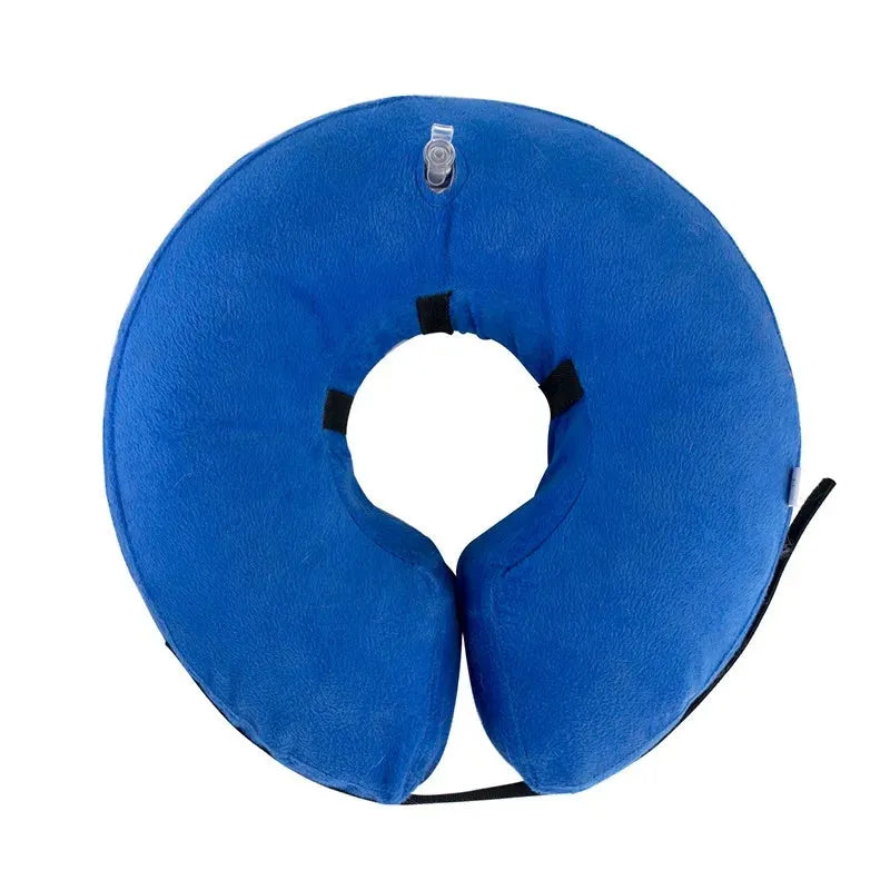 Inflatable soft pet recovery collar in blue with air valve, shown on surface
