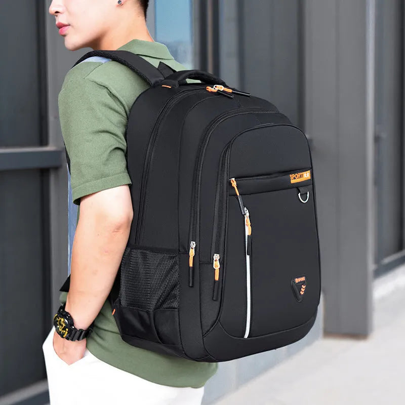 Men's Oxford cloth schoolbag in red with letter pattern, showing air pillow belt and large main compartment.