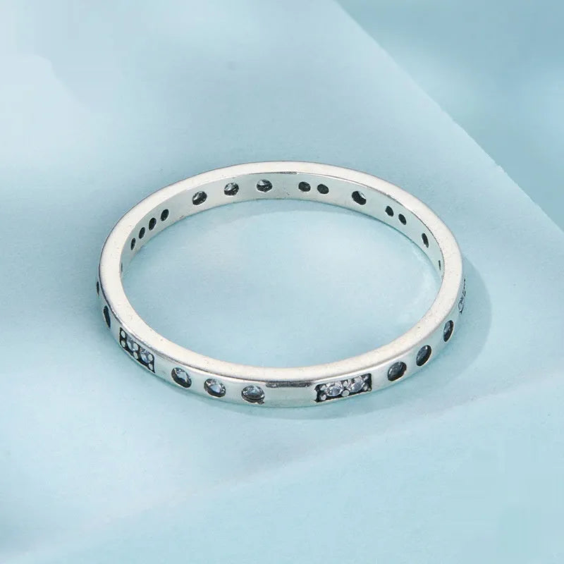 Silver Moss Password I Love You ring with oxidised black finish on a simple band.