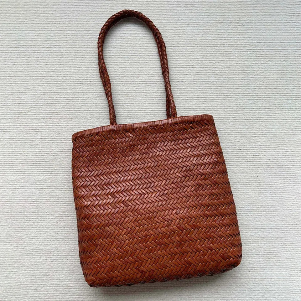 Brown woven leather tote bag with three-dimensional pockets measuring 27x30x6cm