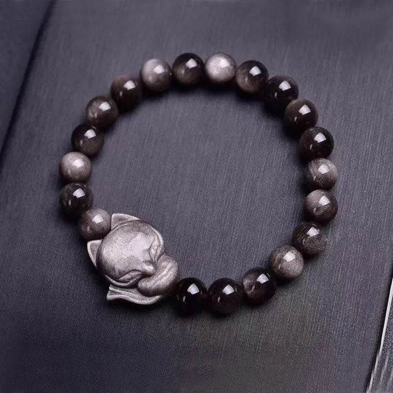 Obsidian fox charm bracelet with 8mm polished stone pendant on a black elastic cord.