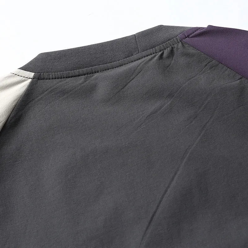 Dark grey men's loose fit t-shirt with contrast raglan sleeves on a neutral background