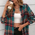 A loose-fit women's plaid shirt in cotton, shown in black, green, and purple colour options with long sleeves.