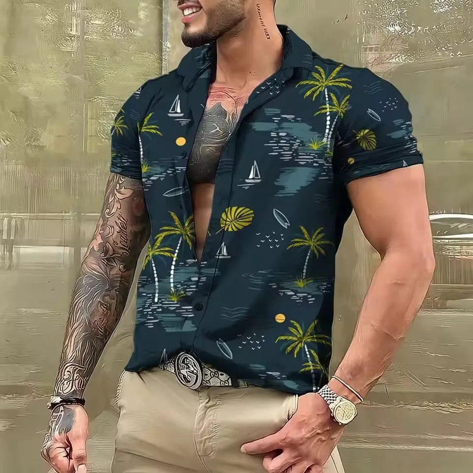 Man wearing a loose floral print short sleeve shirt in a cardigan style on a beach.