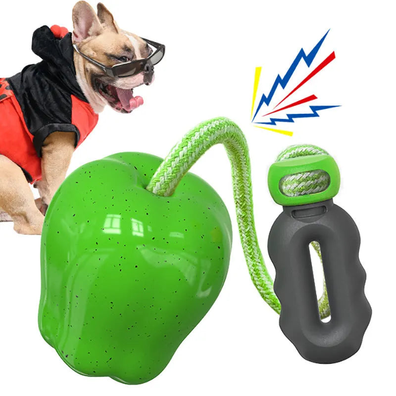 Green apple-shaped plastic dog toy with food dispensing ball compartment for interactive chewing play