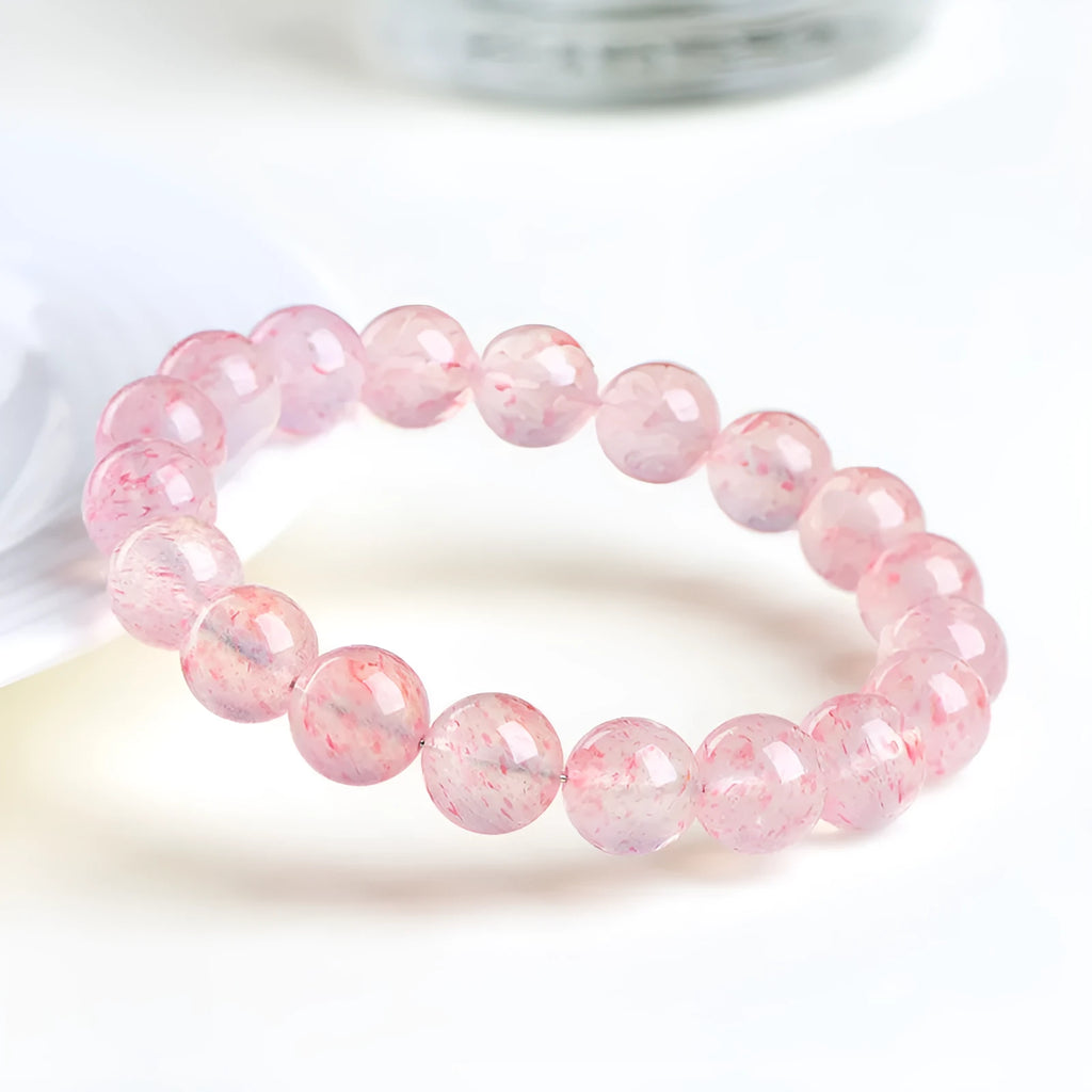 Strawberry quartz crystal bracelet with 10-10.8mm geometric beads in natural white water colour