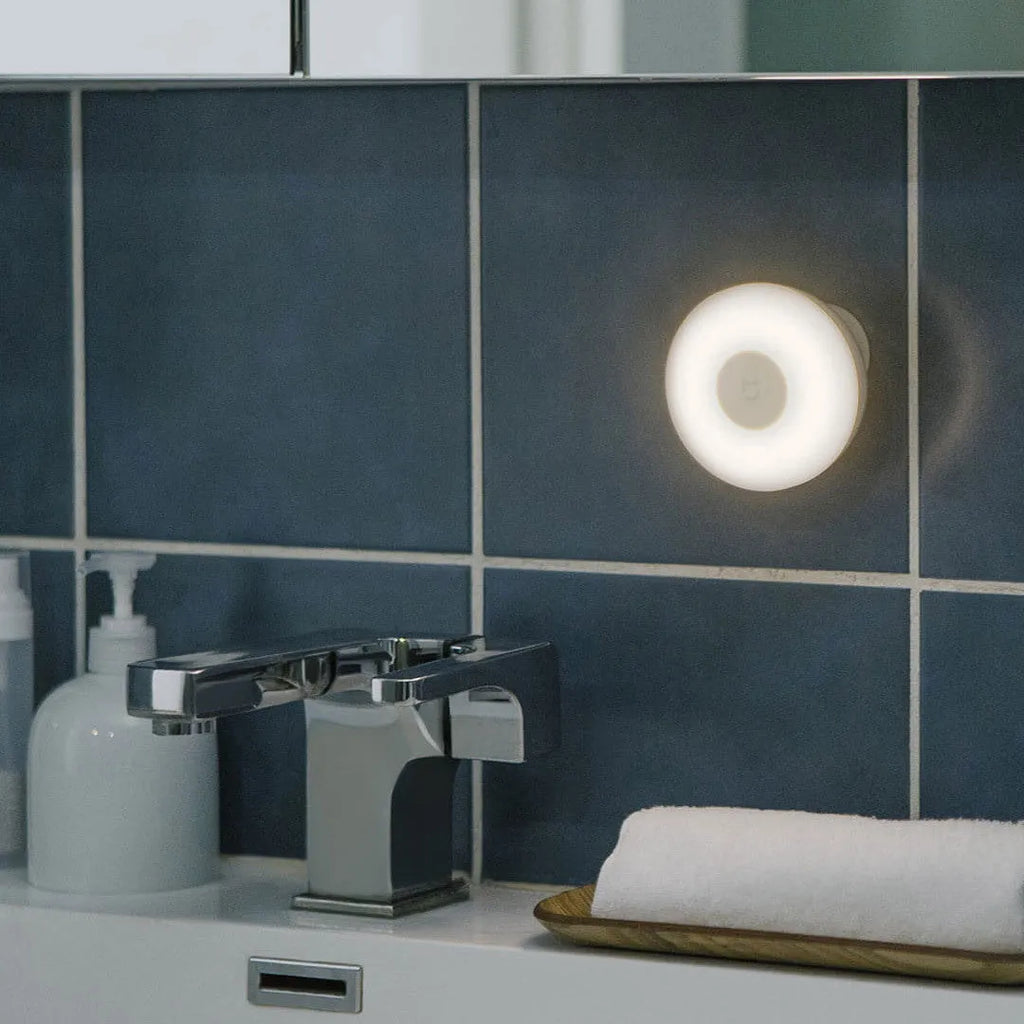 White Mijia Night Light 2 Bluetooth bedside lamp with human body induction on a table.