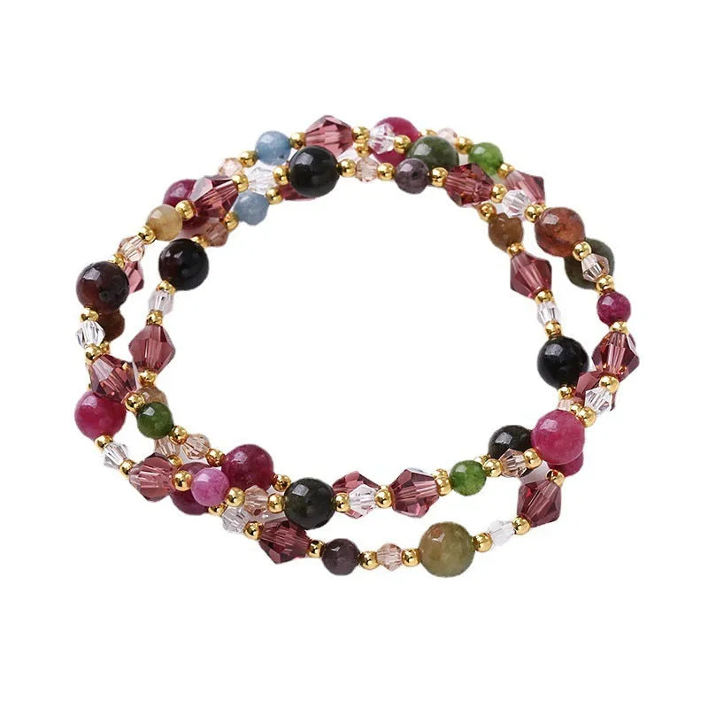 Women's handmade adjustable bracelet with tourmaline, strawberry quartz, and amethyst crystals