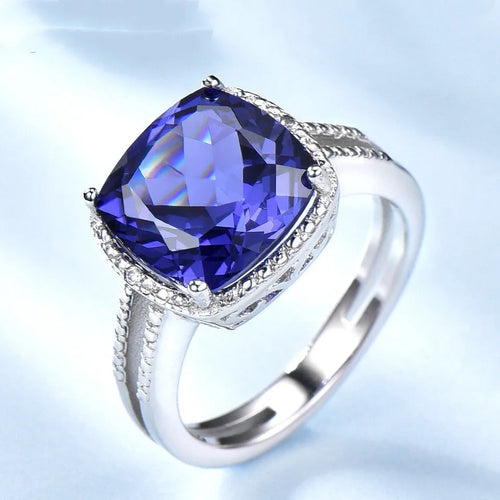Blue tanzanite stone set in a sterling silver women's ring.