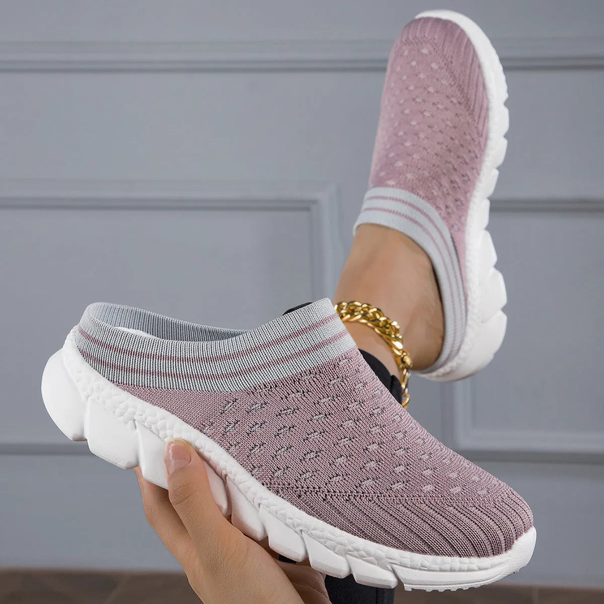 Women's Flyknit semi-slipper casual shoes in striped pattern with hollowed-out details, shown in black, pink, and purple.