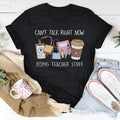 Black straight-cut cotton summer T-shirt with short sleeves and round neck on hanger