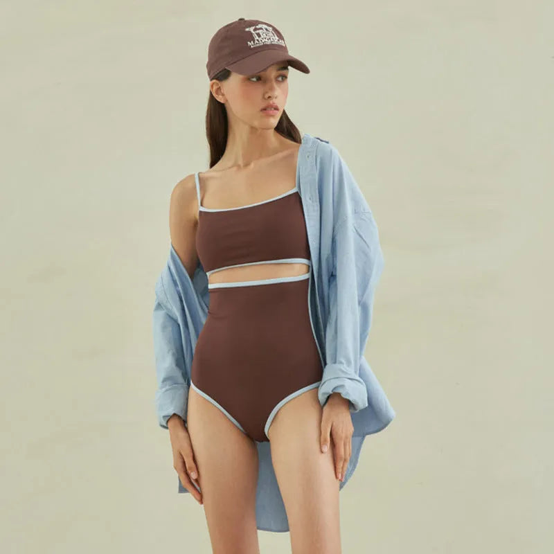 Brown women's triangle one-piece swimsuit made from nylon fabric.