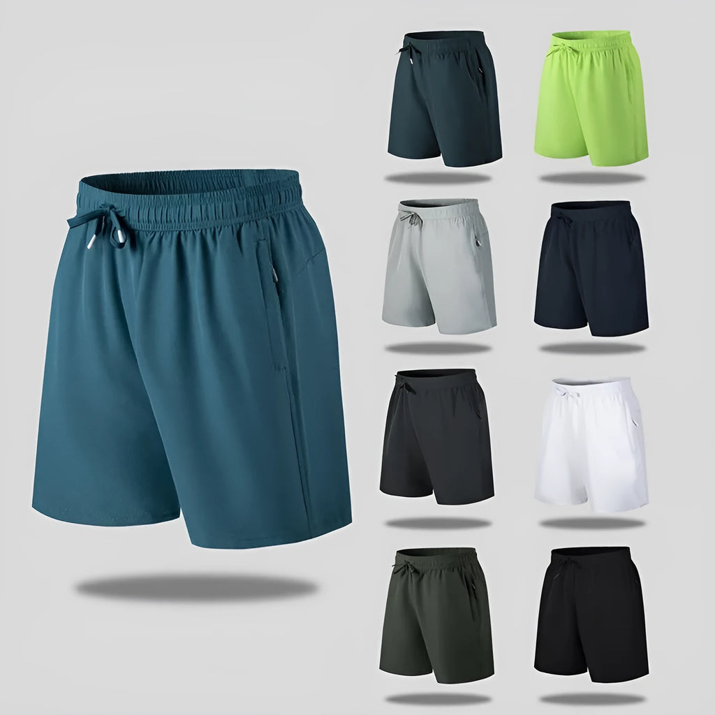 Man wearing loose-fit black quick-dry sports shorts made from ice silk polyester fabric.