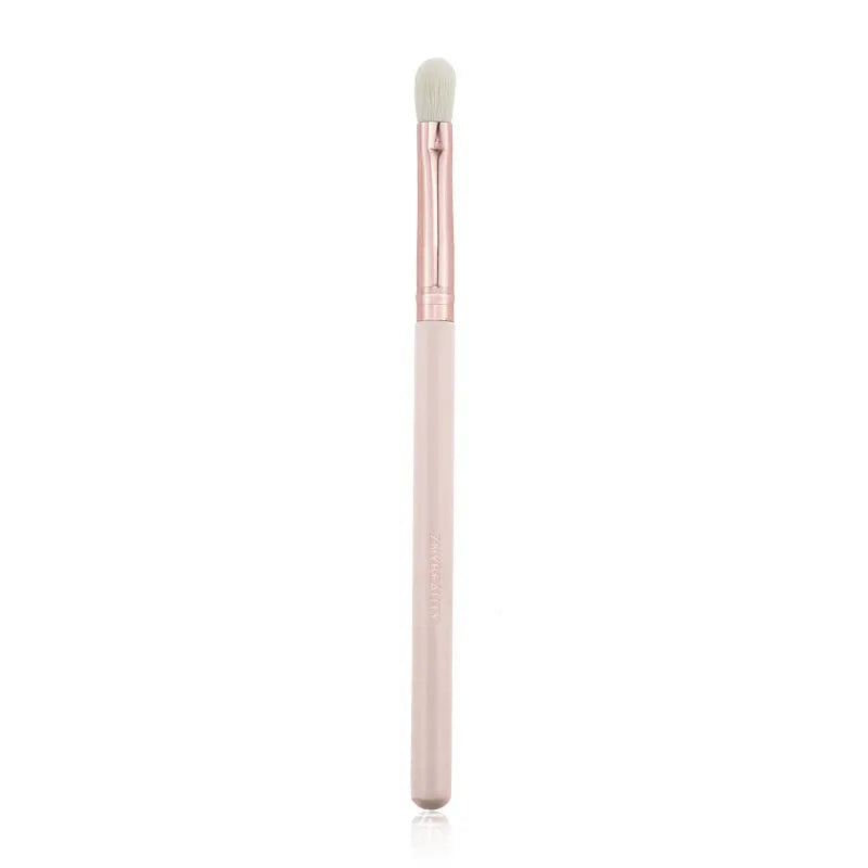 26 pink makeup brushes with wooden handles laid out next to a matching storage bag.