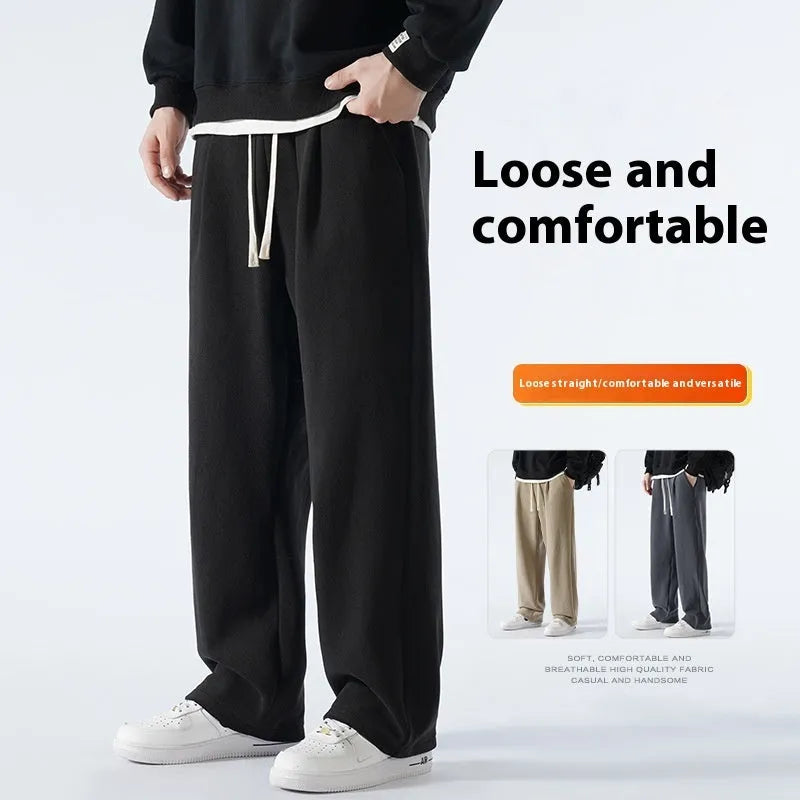 Men's double-sided polar fleece winter sports trousers in apricot colour, showing loose fit and drawstring waistband.