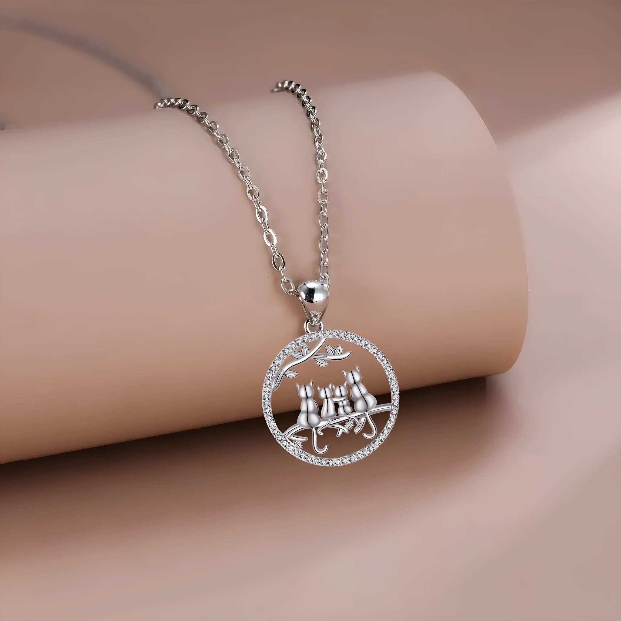 Original design copper necklace with four kitten pendants on a cross chain for women.