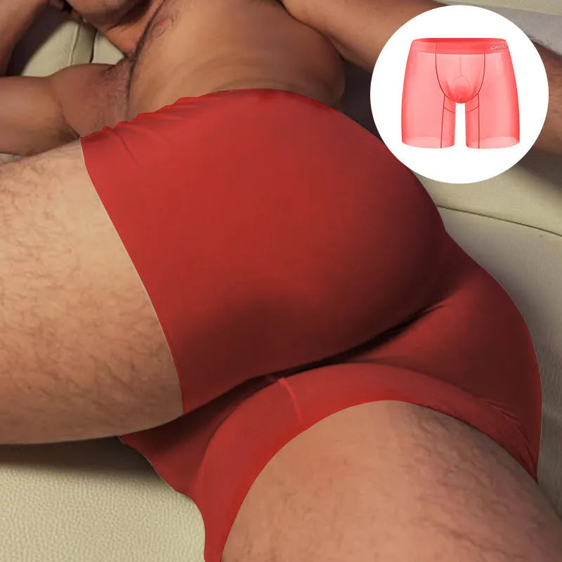 Men's orange seamless nylon sports boxers with low-rise waist on a grey background