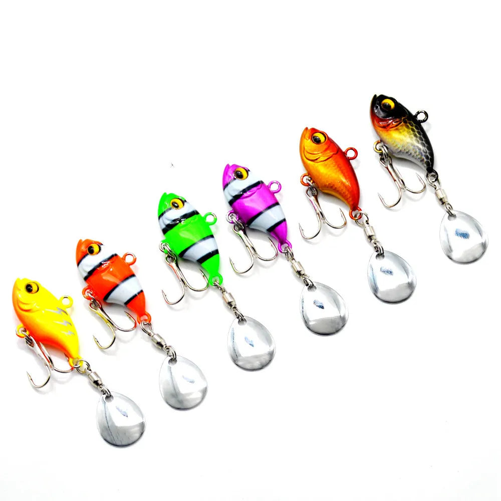 Metal iron plate fishing lure with rotating sequins in zebra stripe orange colour pattern.