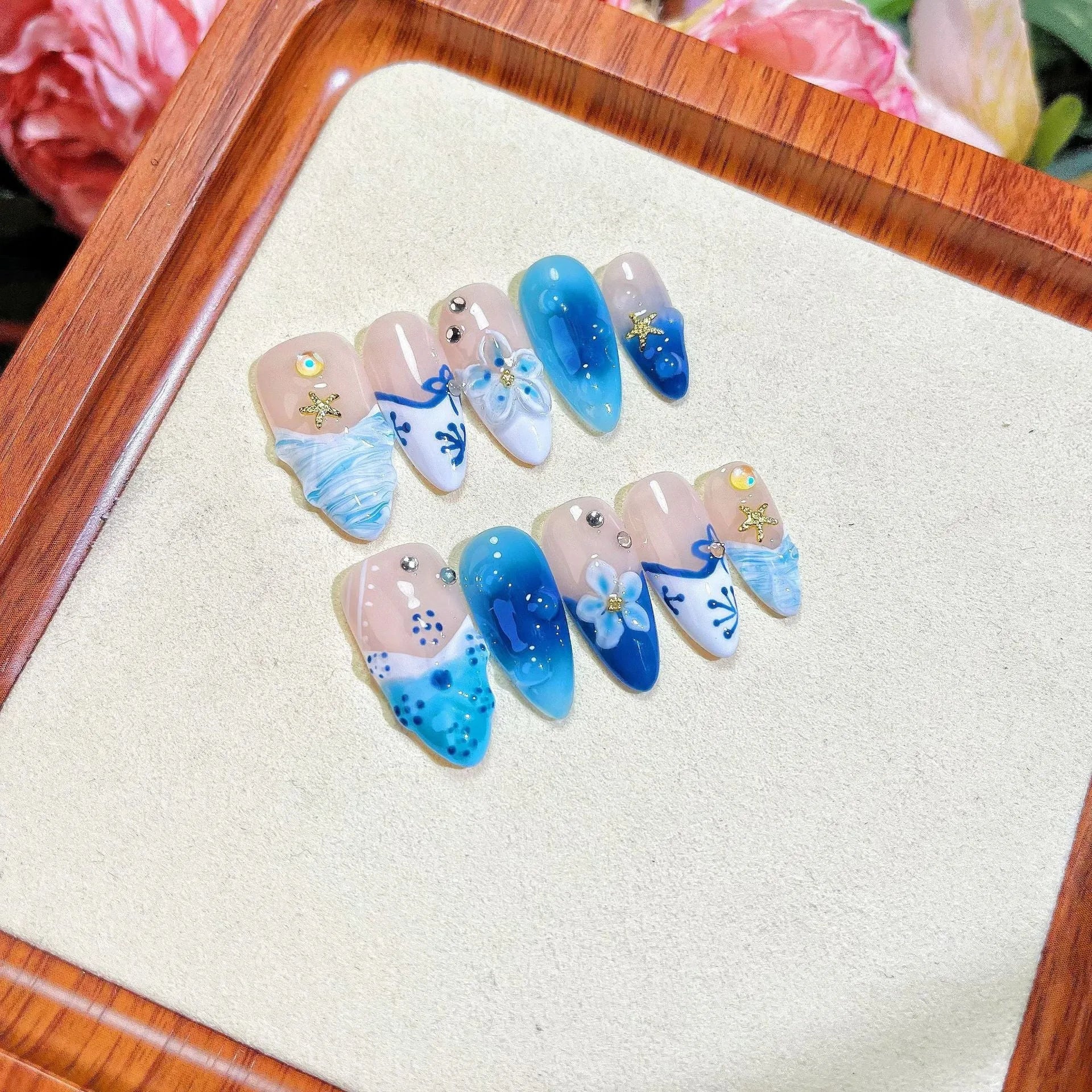 Blue hand-painted carved transparent plastic fake nails set in sizes XS to L