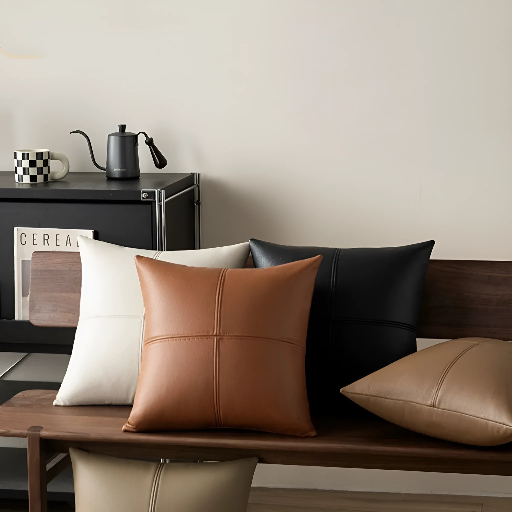 Solid colour soft cowhide leather square pillow cover on a sofa, shown in a beige white colour.