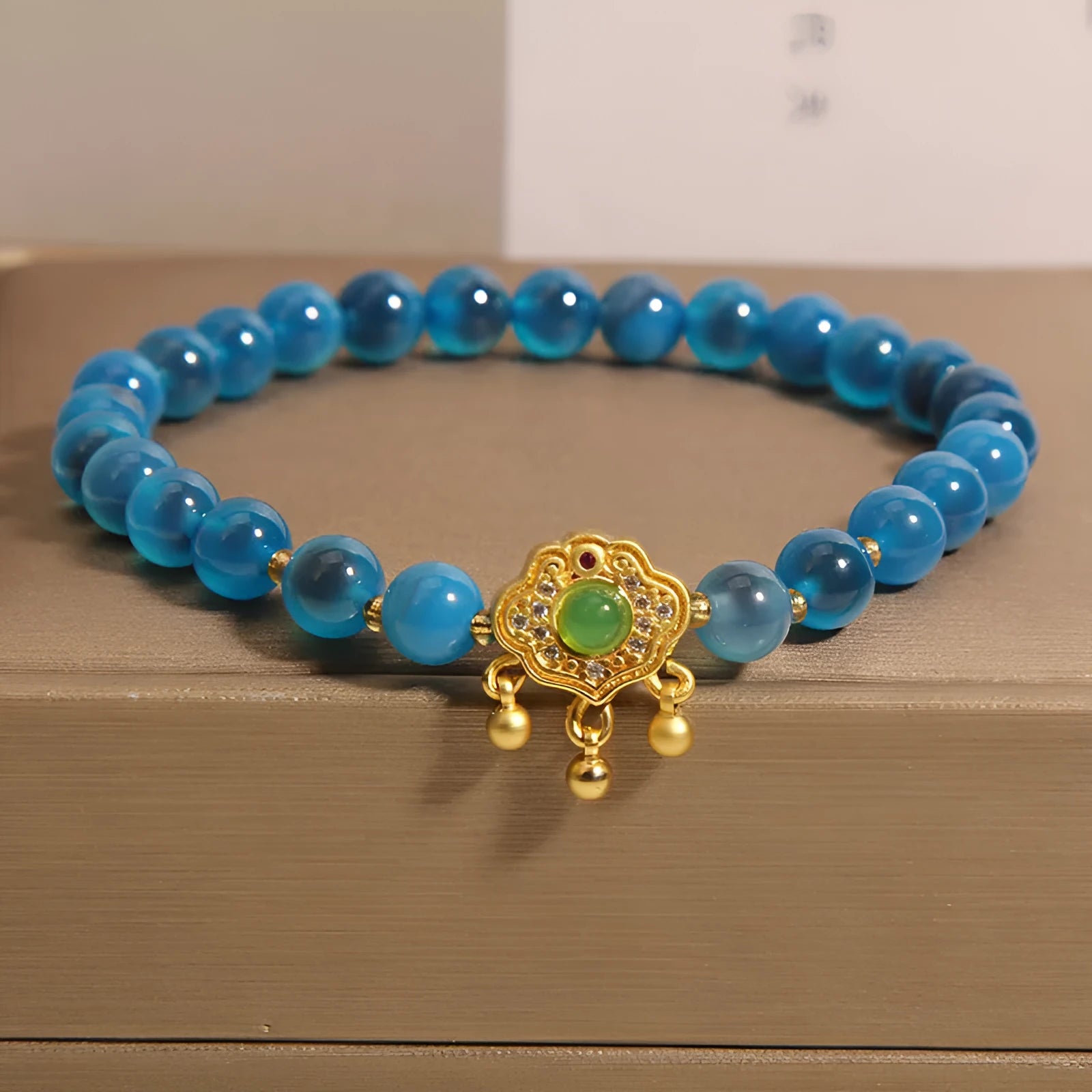 Women's blue agate safety lock pendant bracelet with crystal and rhinestone details