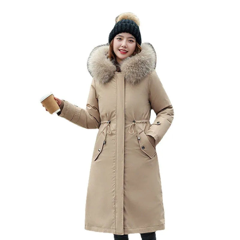 Women's white cotton-padded trench coat with two-way zip showing extended 100cm length and long sleeves