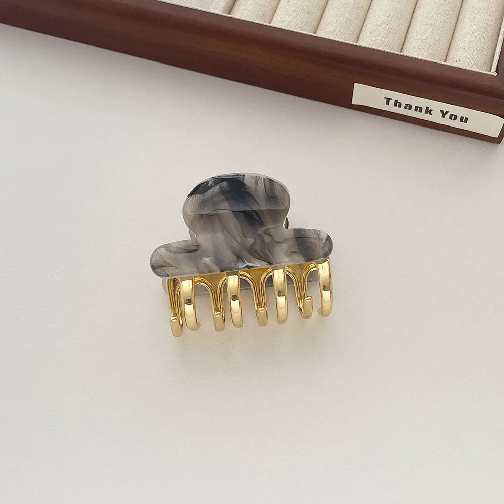 Dopamine retro acetate hair barrette with a metal grip in a medium size, shown in beige colour.