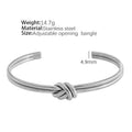 Gold or silver adjustable women's bracelet with knotted C-shaped open design and double layers.