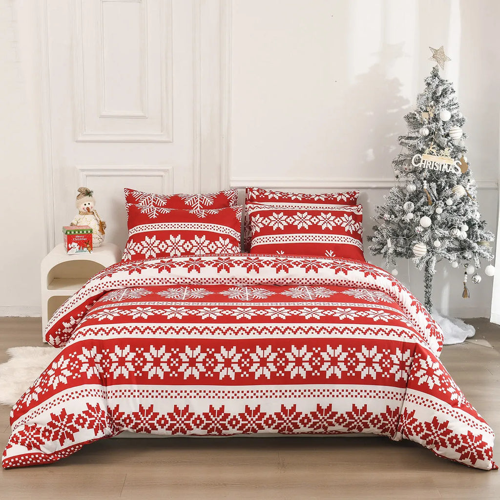 Red Christmas Love Song pattern bed cover-style quilt and pillowcases on a bed.