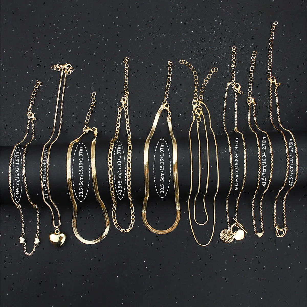 Gold women's necklace set of 10 pieces with snake bone chains and adjustable length
