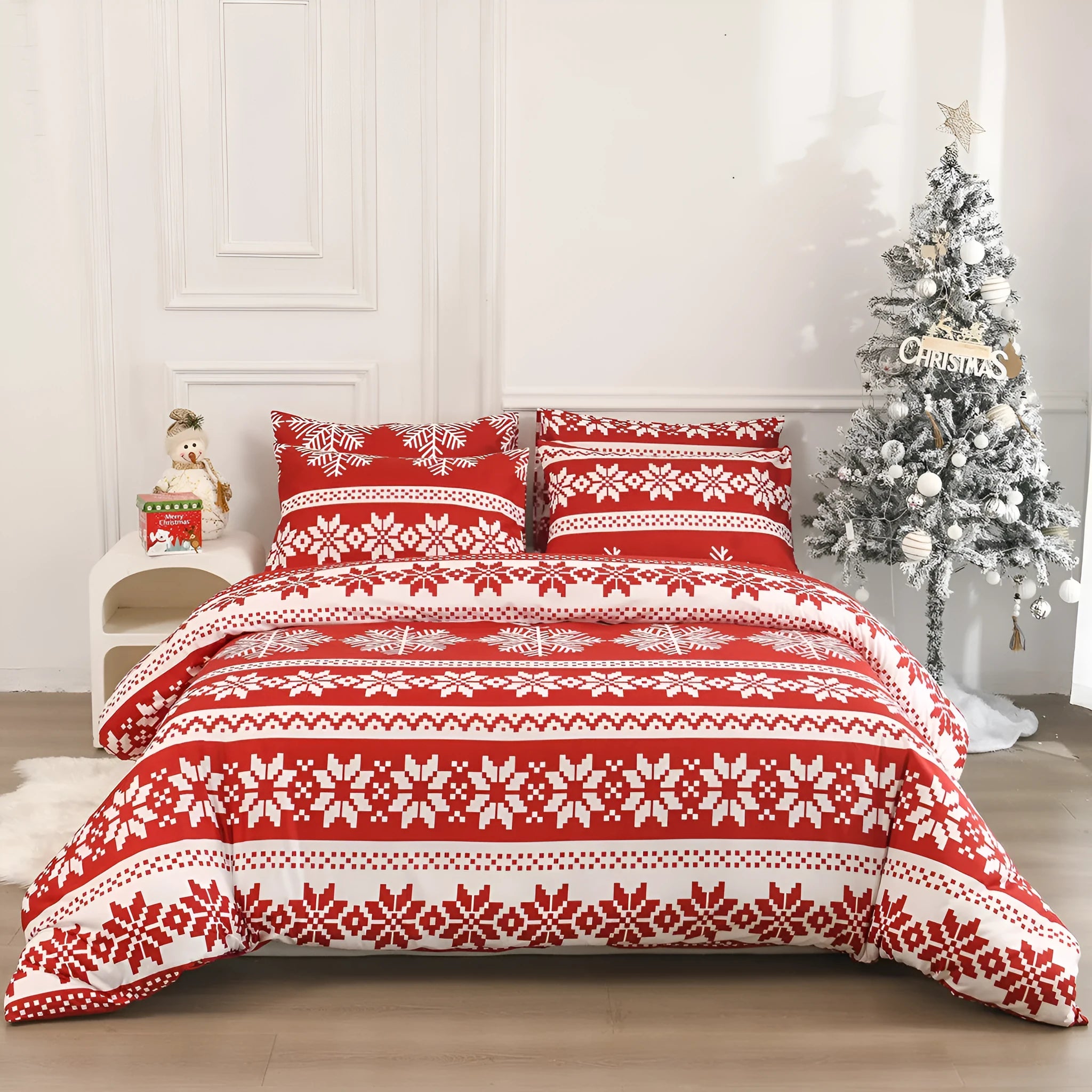 Red Christmas Love Song pattern bed cover-style quilt and pillowcases on a bed.